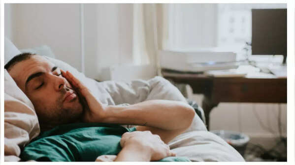 Person feeling fatigued and weak