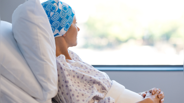 Person feeling overwhelmed by cancer diagnosis