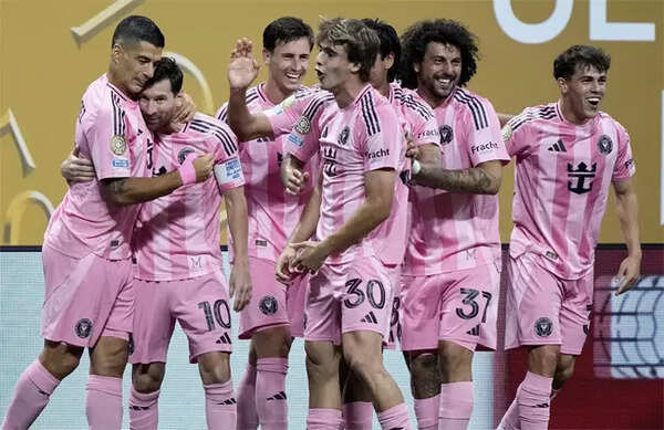 Lionel Messi and Luis Suarez celebrate a goal for Inter Miami against FC Porto.